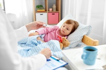 healthcare, medicine and people concept - close up of doctor with thermometer measuring temperature of little sick girl lying in bed at home. doctor measuring sick girl’s temperature