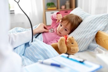 healthcare, medicine and people concept - doctor with stethoscope checking little sick girl’s lungs at home. doctor with stethoscope and sick girl in bed