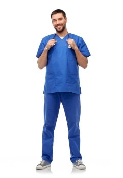 healthcare, profession and medicine concept - happy smiling doctor or male nurse in blue uniform with stethoscope over white background. smiling doctor or male nurse with stethoscope