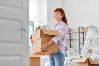 moving, people and real estate concept - happy smiling asian woman holding box with stuff at new home. happy woman unpacking boxes and moving to new home