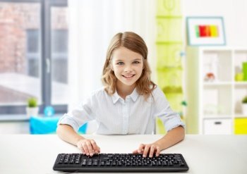 education, school and technology concept - happy smiling student girl with keyboard over home room background. happy student girl with keyboard at home