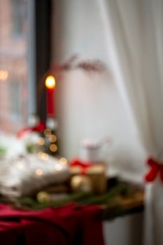 winter holidays, celebration and background concept - blurred still life of christmas decorations on window sill at home. blurred background of christmas decor on window