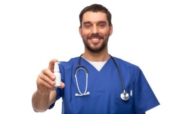 healthcare, profession and medicine concept - happy smiling doctor or male nurse in blue uniform with oral spray and stethoscope over white background. smiling doctor or male nurse with medicine