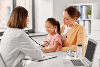 medicine, healthcare and pediatry concept - mother with little daughter and doctor with stethoscope at clinic. mother, girl and doctor with stethoscope at clinic