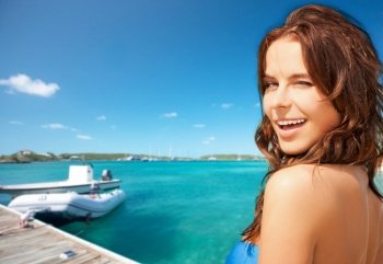 travel, tourism and summer vacation concept - beautiful winking woman over wooden pier and boat on tropical beach background in french polynesia. beautiful winking woman on beach