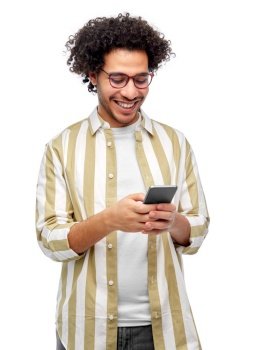 people and technology concept - happy smiling man in glasses with smartphone over white background. happy smiling man in glasses with smartphone