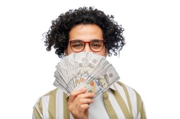 finance, currency and people concept - happy man holding hundreds of dollar money banknotes over white background. happy man with dollar money