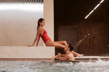 Couple in love at luxury Hotel Spa and pool