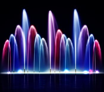 Lit night colorful fountain from water jets of various size on dark background realistic vector illustration. Lit Night Colorful Fountain Realistic Illustration