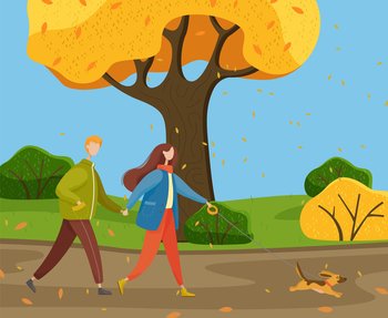 Autumn park, yellow trees, bushes, falling leaves, young warmly dressed couple walking cheerful little dog on leash. Happy pet. Woman and man are holding hands. Family in various weather conditions. People walk dog on leash, autumn park or countryside, fall leaves, yellow trees, bushes. Autumn time