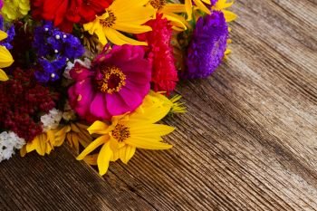 Bright fall posy on wooden background with copy space. Bright fall bouquet