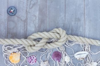 marine knot with fishing net on wooden background with copy space. marine knot