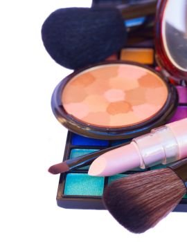 Decorative colorful  make up cosmetics  - eye shadows, lipstick and powder  border isolated on white background. Decorative cosmetics border
