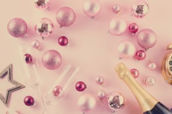 Christmas party with champagne, frame on pink background, retro toned. Christmas party with champagne