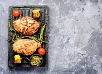 Grilled chicken breast with vegetable on kitchen board.Healthy food. Grilled healthy chicken breasts