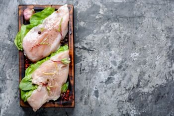 Fresh raw chicken on kitchen cutting board. Fresh chicken meat