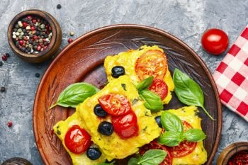 Polenta with tomatoes and cheese.Italian cuisine.Traditional polenta. Polenta Italian cornmeal dish