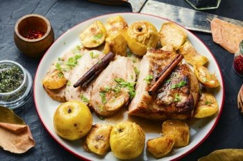 Baked meat with apples.Fried pork loin stuffed with apple. Slices of baked pork loin
