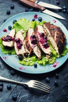 Appetizing chicken breast with huckleberry. Sliced grilled chicken meat.. Chicken breast with blueberry sauce