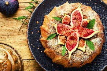 Colorful homemade pie with autumn figs.Galette with figs. Autumn pie with figs,wooden background