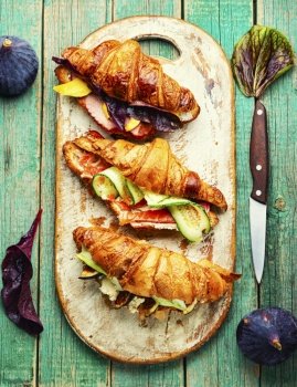 Tasty croissants with salted filling.Croissant sandwich with meat and fish filling. Croissants with meat and fish,healthy breakfast