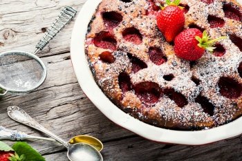 Traditional strawberry pie on rustic wooden table.Strawberry tart. Baked strawberry tart pie