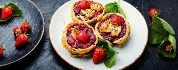 Delicious tartlets with berry jam.Cake with strawberries.Long banner. Summer tartlets with strawberries,extra wide