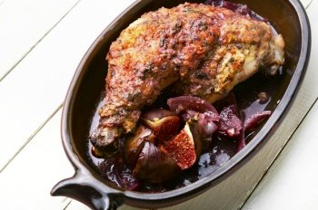Chicken thigh fried in fig fruit. Meat poultry with figs sauce.. Chicken leg with figs in Greek