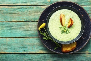 Puree soup, dietary zucchini and herb soup, garnished with croutons.Summer soup. Vegetable summer soup, puree soup
