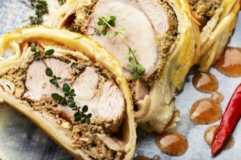 Juicy meat in a dough with spices, mushroom or vegetable pate. Wellington meat.. Wellington meat is a festive tenderloin dish.