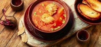 Borscht - hot soup based on beets and meat. Red borscht, traditional dish of russian cuisine. Red Ukrainian borscht