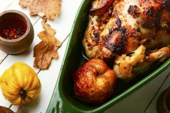 Fragrant whole roast chicken stuffed with apples and quince.. Delicious homemade chicken with quince