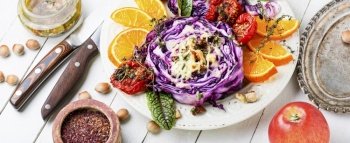 Vegan dish of red cabbage, orange and nuts. Healthy appetizer. Banquet food. Red cabbage banquet appetizer.