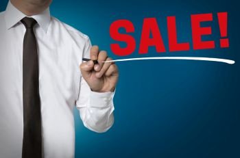 Sale is written by businessman background.. Sale is written by businessman background