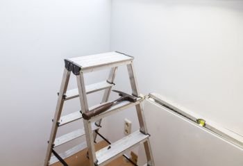 Ladder with hammer and spirit level for renovation.. Ladder with hammer and spirit level for renovation