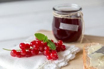 Currant jam in a jar with cord.. Currant jam in a jar with cord