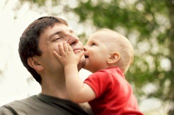 son kissing his father