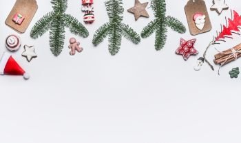 White Christmas background with various decoration, fir branches and cookies  , top view with copy space for your design