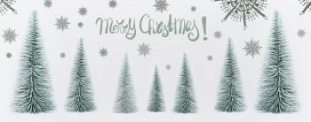 Merry Christmas greeting card with decorative fir trees forest and painted snowflakes on white background, banner