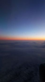  cloudscape background from airplane . sunset