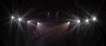 rays of light illuminate the scene at the concert.