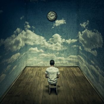 Abstract idea with a person sitting in a dark room in front of a clock surrounded by limitations daily routine concrete walls with clouds texture. Time pressure deadline concept