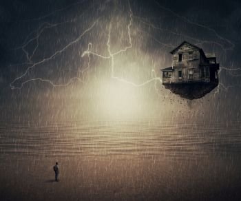 Surreal backround of a man standing in the rain, in front of a flying house ripped from the ground, near the ocean. Sixth sense concept.