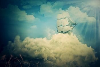 Surreal screensaver with an old ship sailing in the clouds