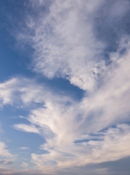 Panoramic cloudscape scene over the blue sky. Fluffy white clouds aerial composition. Misty overcast cumulus shapes, abstract nebula textures. Air fresheners, celestial beauty, vertical background