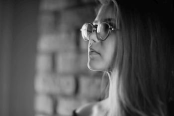 girl loft interior studio glasses / businesswoman in glasses, confidence, youth, nature.