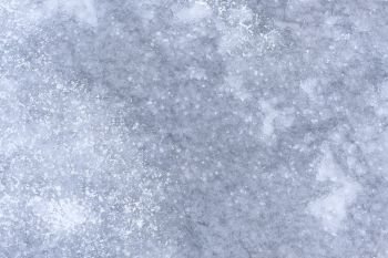 abstract winter background / gray ice with snow, background for text. abstract background cold with snowfall.