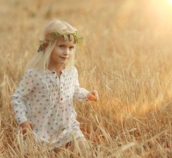 cheerful little girl on the nature of soft light portrait