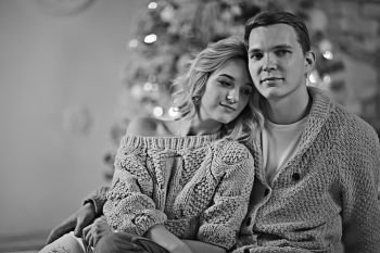 New Year’s photo people / young man and girl in the Christmas interior, cozy decorated house
