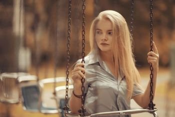 Young girl in autumn portrait, blond adult